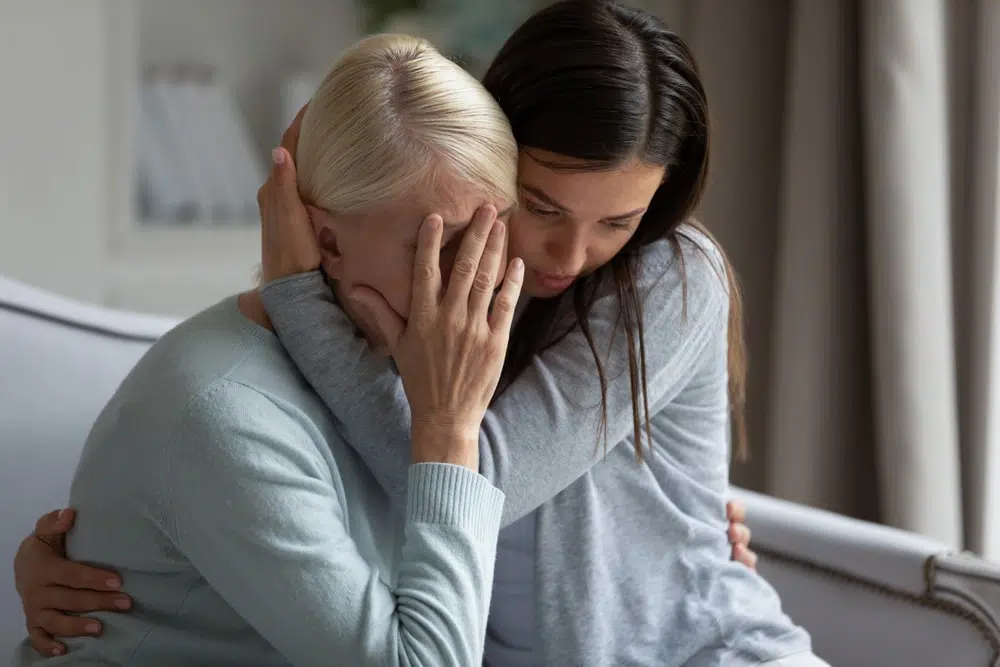 Wrongful Death Grieving Two women grieving a wrongful death of a relative